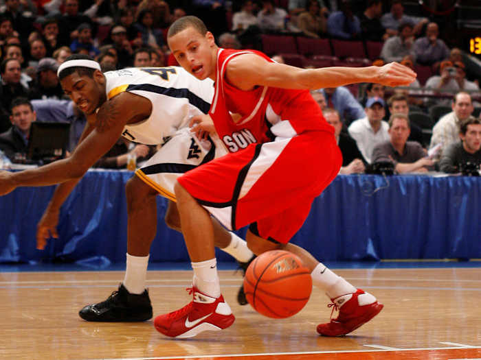 Davidson Wildcats guard Stephen Curry reaches for a loose ball.